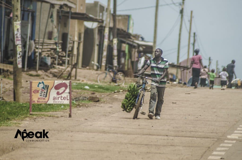 A man transports his merchandise on a bicycle boda boda. Photo credit : Watsemba Miriam