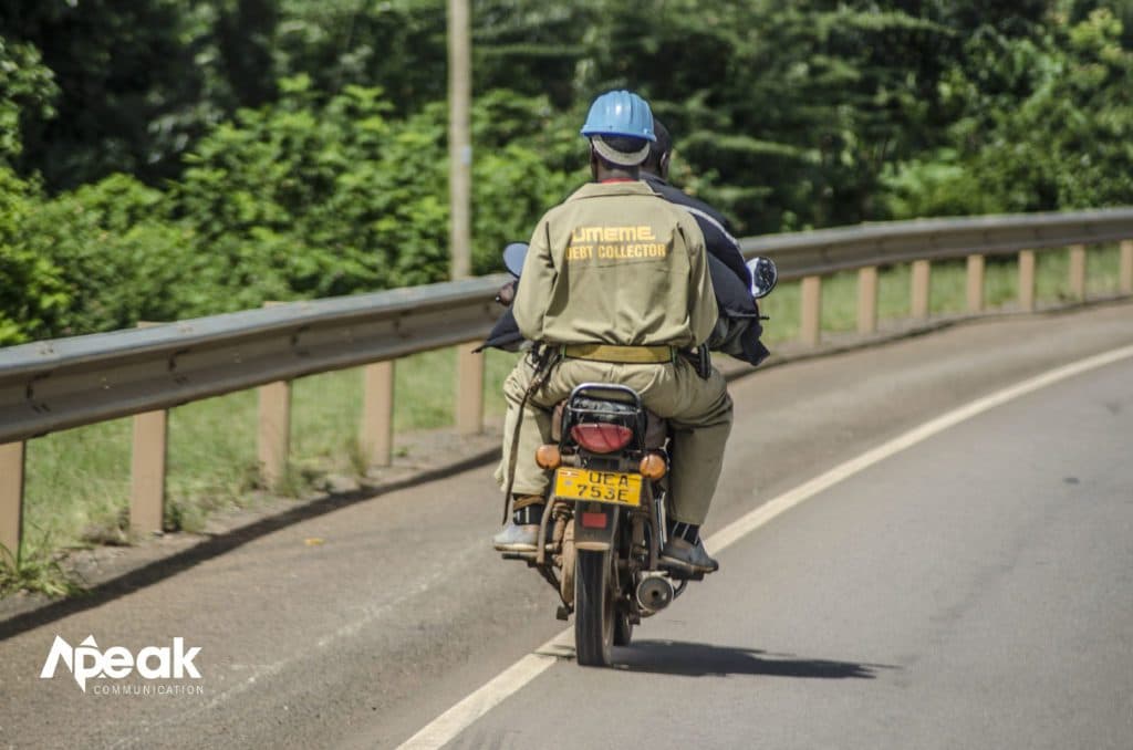 A queue of motor cycles in accelerating motion on a highway in Uganda. Photo credit : Watsemba Miriam